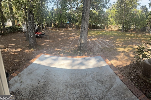 206 Audubon Way, Warner Robins, GA 31088 - fenced yard with central air condition unit and a patio area