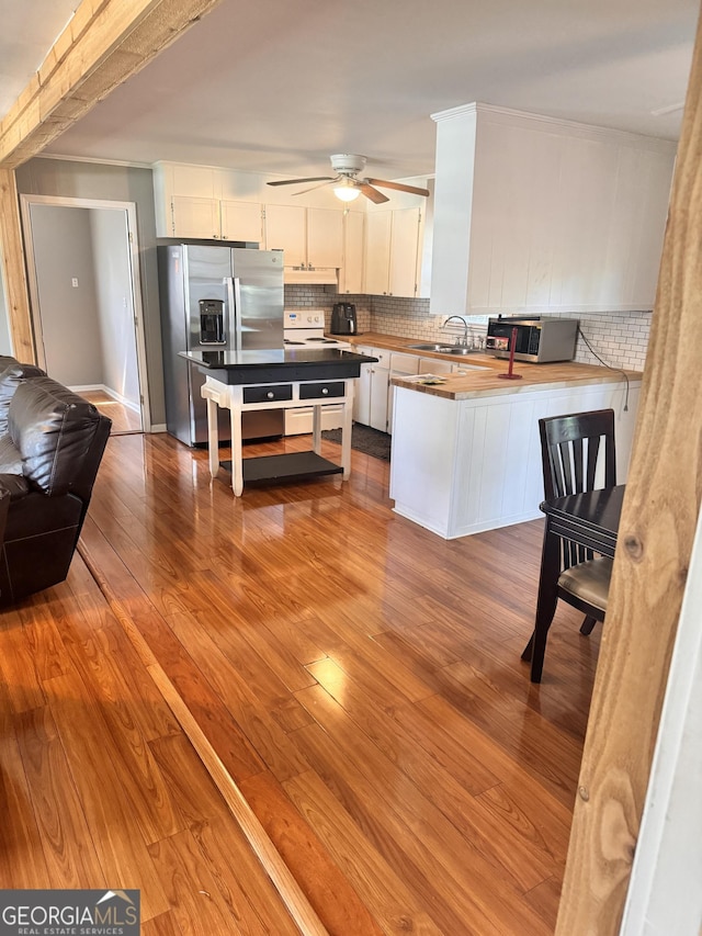 206 Audubon Way, Warner Robins, GA 31088 - kitchen with stainless steel appliances, a sink, tasteful backsplash, and white cabinets