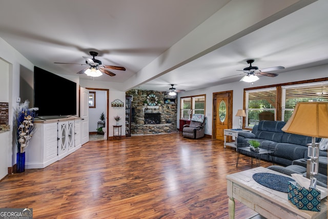 894 Lake Circle Rd, Buchanan, GA 30113 - living area featuring ceiling fan, wood finished floors, a stone fireplace, and baseboards