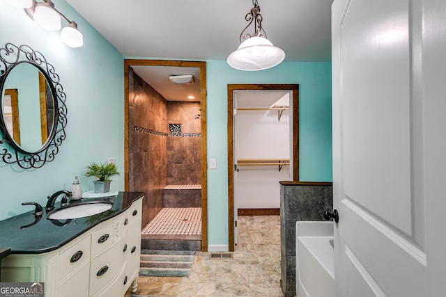 894 Lake Circle Rd, Buchanan, GA 30113 - full bath with tiled shower, vanity, a garden tub, and a walk in closet
