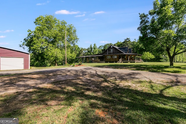 894 Lake Circle Rd, Buchanan, GA 30113 - view of grassy yard featuring an outbuilding and a detached garage