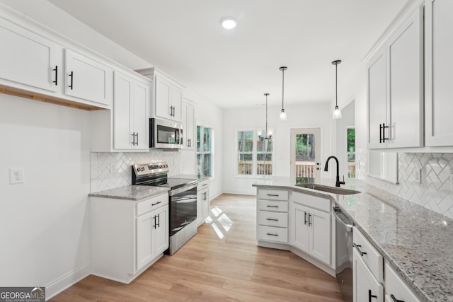2279 Lakeview Pkwy, Villa Rica, GA 30180 - kitchen with stainless steel appliances, a sink, white cabinets, backsplash, and recessed lighting