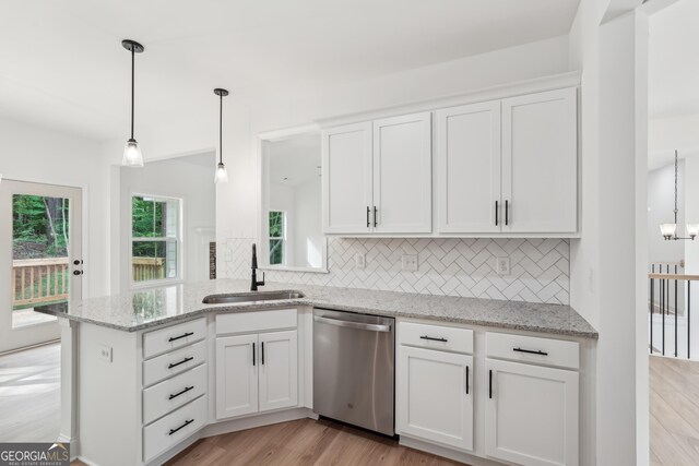 2279 Lakeview Pkwy, Villa Rica, GA 30180 - kitchen featuring dishwasher, a sink, tasteful backsplash, and white cabinets