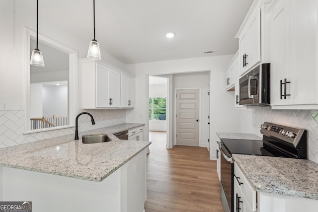 2279 Lakeview Pkwy, Villa Rica, GA 30180 - kitchen featuring stainless steel appliances, a sink, decorative backsplash, and recessed lighting