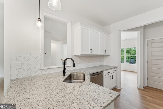 2279 Lakeview Pkwy, Villa Rica, GA 30180 - kitchen featuring a sink, stainless steel dishwasher, white cabinets, and backsplash