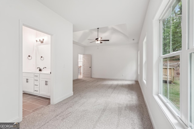 2279 Lakeview Pkwy, Villa Rica, GA 30180 - unfurnished living room featuring ceiling fan, carpet flooring, a sink, baseboards, and tile patterned floors
