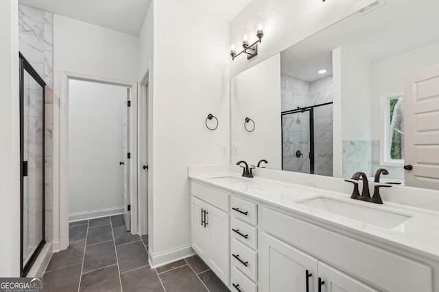 2279 Lakeview Pkwy, Villa Rica, GA 30180 - bathroom with a shower stall, double vanity, and baseboards