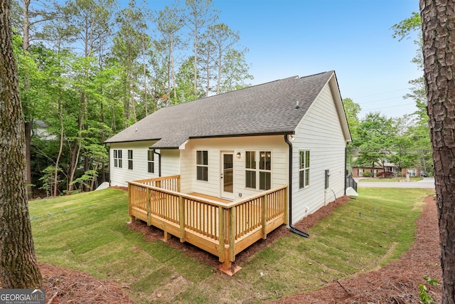 2279 Lakeview Pkwy, Villa Rica, GA 30180 - back of property featuring a shingled roof, a lawn, and a wooden deck