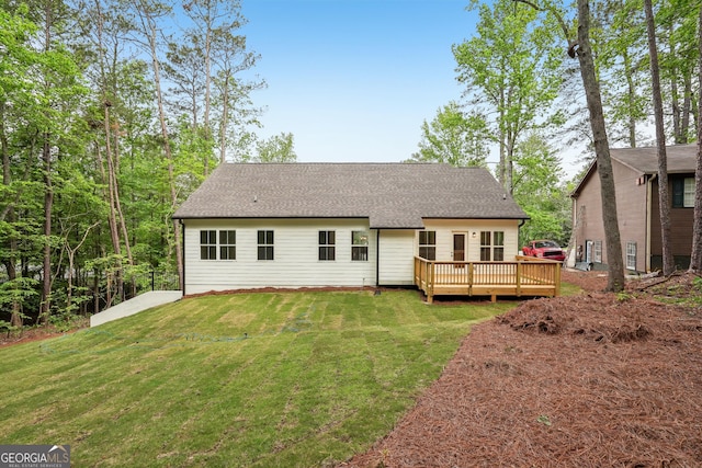2279 Lakeview Pkwy, Villa Rica, GA 30180 - back of house with a deck, a yard, and roof with shingles