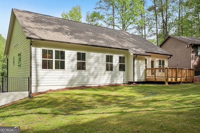 2279 Lakeview Pkwy, Villa Rica, GA 30180 - rear view of property with a deck, roof with shingles, and a lawn