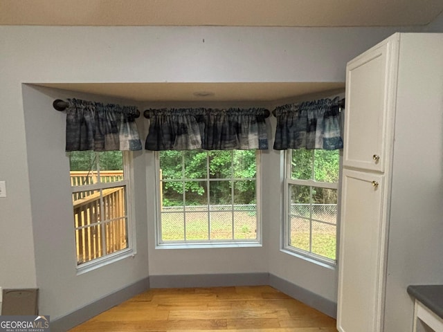 161 Cedar Cove Dr, Buckhead, GA 30625 - unfurnished dining area with light wood-type flooring and baseboards