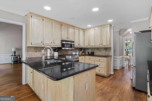 4381 Laurian Dr NW, Kennesaw, GA 30144 - kitchen with appliances with stainless steel finishes, crown molding, light brown cabinetry, a peninsula, and dark wood-style flooring