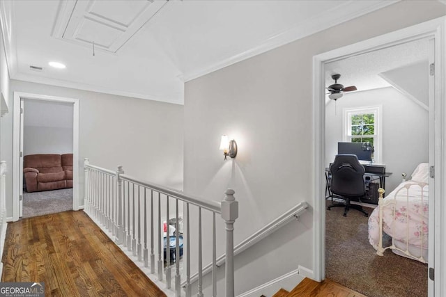4381 Laurian Dr NW, Kennesaw, GA 30144 - hallway featuring attic access, an upstairs landing, wood finished floors, a desk, and ornamental molding