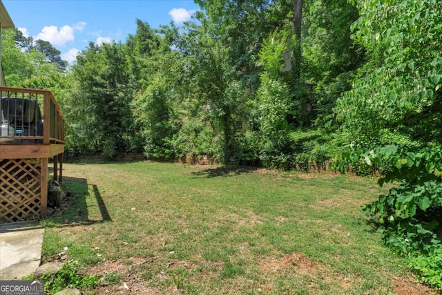 4381 Laurian Dr NW, Kennesaw, GA 30144 - view of grassy yard featuring a deck