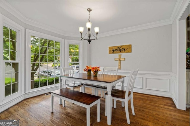 4381 Laurian Dr NW, Kennesaw, GA 30144 - dining room featuring a chandelier, healthy amount of natural light, ornamental molding, and wood finished floors