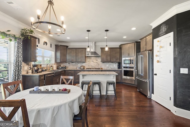 1858 Switchgrass Dr, Statham, GA 30666 - dining room featuring a chandelier, ornamental molding, dark wood-style floors, and recessed lighting