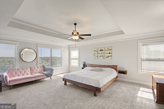 1858 Switchgrass Dr, Statham, GA 30666 - bedroom with a tray ceiling, crown molding, carpet, baseboards, and a ceiling fan