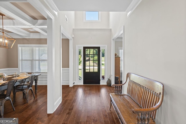 1858 Switchgrass Dr, Statham, GA 30666 - foyer entrance featuring plenty of natural light, ornamental molding, a wainscoted wall, a chandelier, and hardwood / wood-style flooring