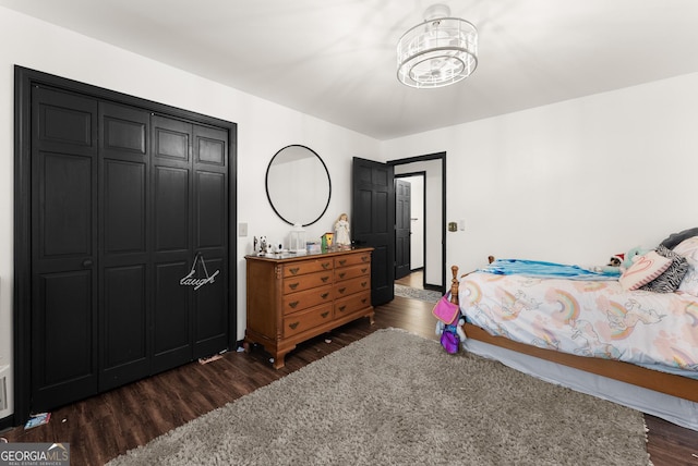 231 Doug Allison Hts, Cleveland, GA 30528 - bedroom featuring dark wood-style flooring, a chandelier, and a closet