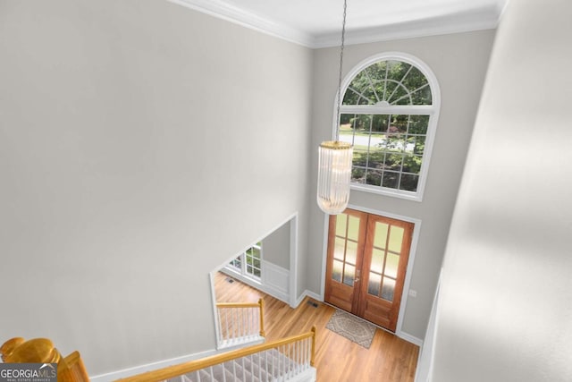 85 Arabian Ave, Alpharetta, GA 30004 - foyer featuring ornamental molding, french doors, wood finished floors, baseboards, and a chandelier