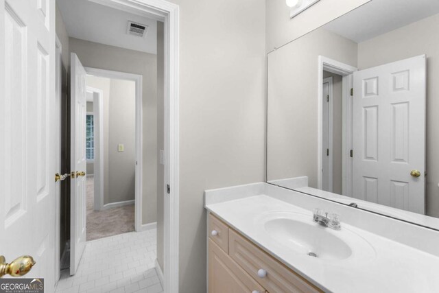 85 Arabian Ave, Alpharetta, GA 30004 - bathroom with vanity, tile patterned floors, and baseboards