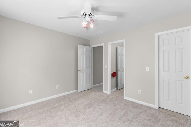 85 Arabian Ave, Alpharetta, GA 30004 - unfurnished bedroom with carpet flooring, baseboards, and a ceiling fan