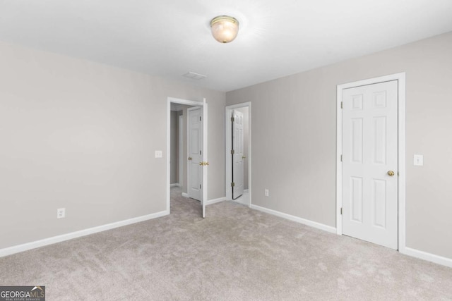 85 Arabian Ave, Alpharetta, GA 30004 - unfurnished bedroom with baseboards and carpet floors