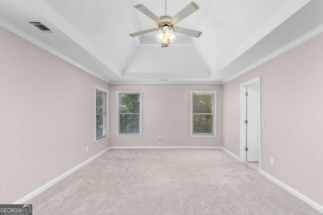 85 Arabian Ave, Alpharetta, GA 30004 - spare room with plenty of natural light, ceiling fan, light colored carpet, a tray ceiling, and crown molding