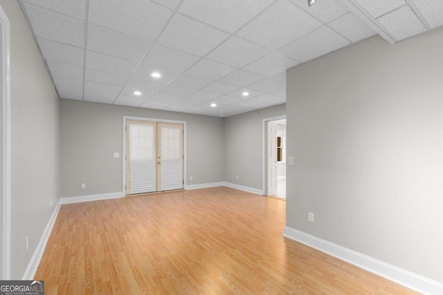 85 Arabian Ave, Alpharetta, GA 30004 - unfurnished room with light wood finished floors, a paneled ceiling, baseboards, and recessed lighting