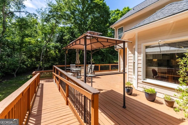 85 Arabian Ave, Alpharetta, GA 30004 - wooden terrace with a gazebo, outdoor dining area, and view of scattered trees
