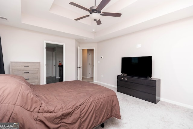 646 Mccarley Downs Dr, Bonaire, GA 31005 - bedroom with a raised ceiling, baseboards, carpet floors, and ensuite bath