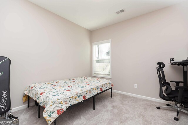 646 Mccarley Downs Dr, Bonaire, GA 31005 - carpeted bedroom with baseboards