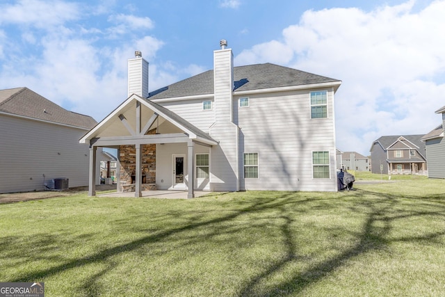 646 Mccarley Downs Dr, Bonaire, GA 31005 - rear view of property featuring a patio, a yard, roof with shingles, a chimney, and stone siding
