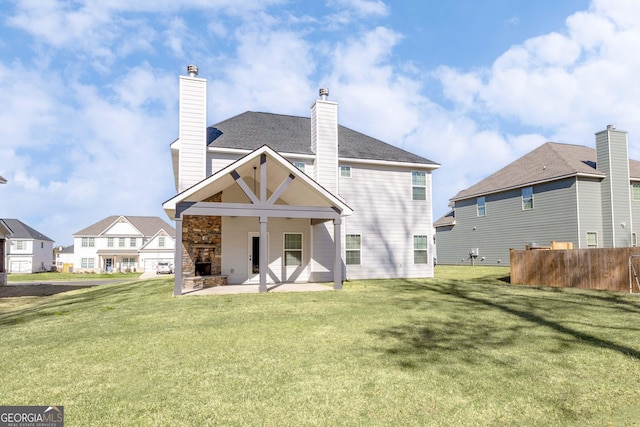 646 Mccarley Downs Dr, Bonaire, GA 31005 - rear view of house featuring a patio and a chimney