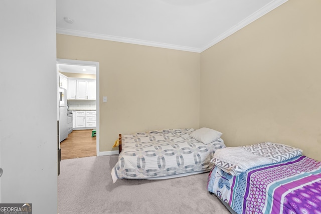 827 Fraser St SE, Atlanta, GA 30315 - bedroom featuring freestanding refrigerator, ornamental molding, light colored carpet, and baseboards