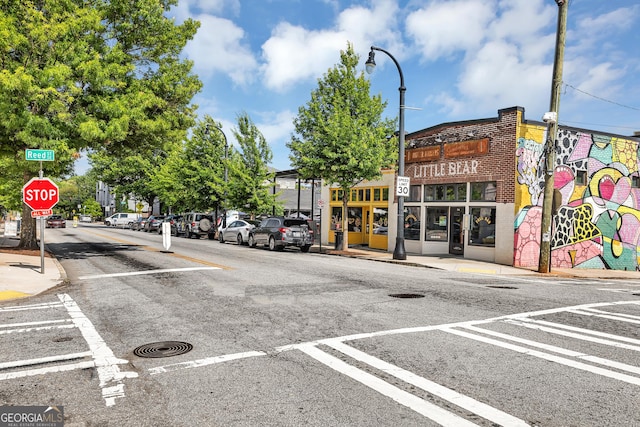 827 Fraser St SE, Atlanta, GA 30315 - view of asphalt street featuring traffic signs, street lighting, sidewalks, and curbs