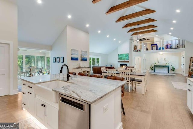 1685 Valley Rd NE, Gainesville, GA 30501 - kitchen with dishwasher, high vaulted ceiling, open floor plan, beamed ceiling, and a center island with sink