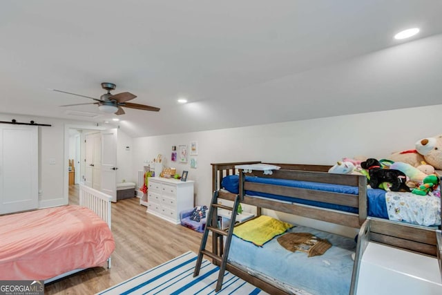 1685 Valley Rd NE, Gainesville, GA 30501 - bedroom featuring light wood-style flooring, a barn door, recessed lighting, ceiling fan, and lofted ceiling