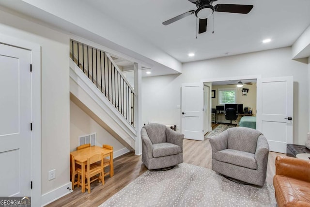 1685 Valley Rd NE, Gainesville, GA 30501 - living area with ceiling fan, wood finished floors, a desk, stairs, and baseboards