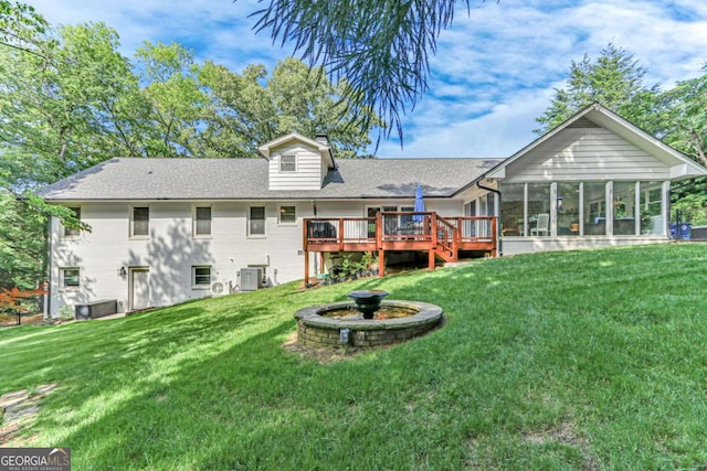 1685 Valley Rd NE, Gainesville, GA 30501 - back of property featuring a chimney, a sunroom, a wooden deck, and a lawn