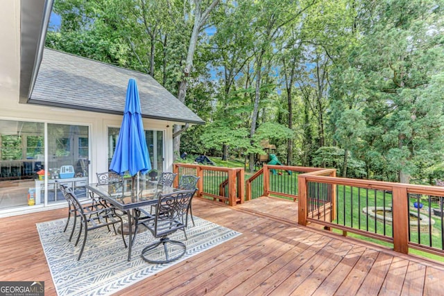 1685 Valley Rd NE, Gainesville, GA 30501 - wooden terrace featuring outdoor dining space and view of wooded area