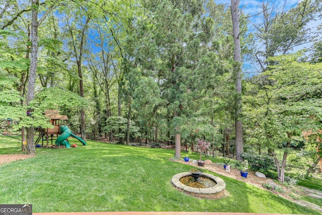 1685 Valley Rd NE, Gainesville, GA 30501 - view of grassy yard with a playground