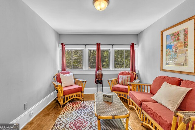 1021 Oak St SW, Atlanta, GA 30310 - sitting room with plenty of natural light, wood finished floors, and baseboards