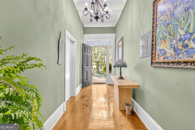 1021 Oak St SW, Atlanta, GA 30310 - foyer with a chandelier, baseboards, wood finished floors, ornamental molding, and electric panel