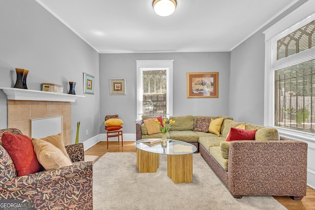 1021 Oak St SW, Atlanta, GA 30310 - living area with wood finished floors, ornamental molding, a fireplace, and baseboards