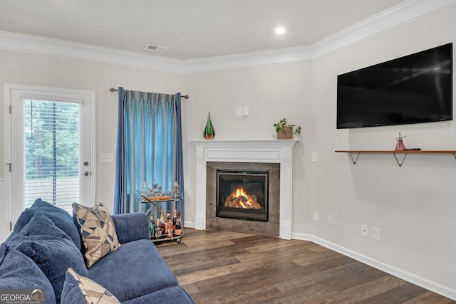 1431 Beckett Dr, Hampton, GA 30228 - living room featuring wood finished floors, ornamental molding, a glass covered fireplace, and baseboards