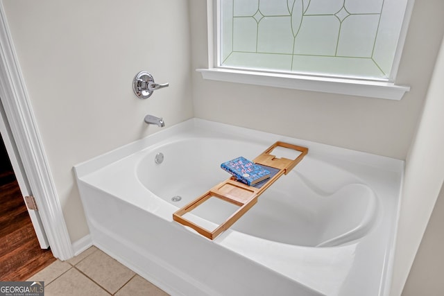 1431 Beckett Dr, Hampton, GA 30228 - bathroom with a tub to relax in and tile patterned floors
