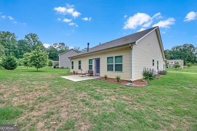 1431 Beckett Dr, Hampton, GA 30228 - back of property with a patio and a lawn