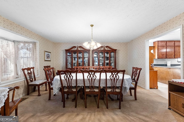 75 Antioch Rd, Mcdonough, GA 30252 - dining room featuring wallpapered walls, a chandelier, light colored carpet, and a textured ceiling