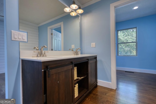 1226 Hull Rd, Athens, GA 30601 - full bathroom with crown molding, wood finished floors, double vanity, and recessed lighting